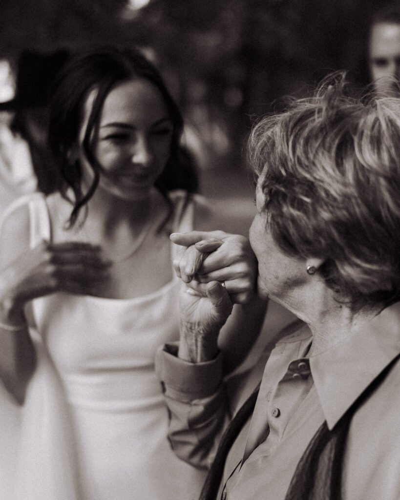 The brides grandmother kisses her newly married hand. A precious moment captured by Eilish Burt Photography