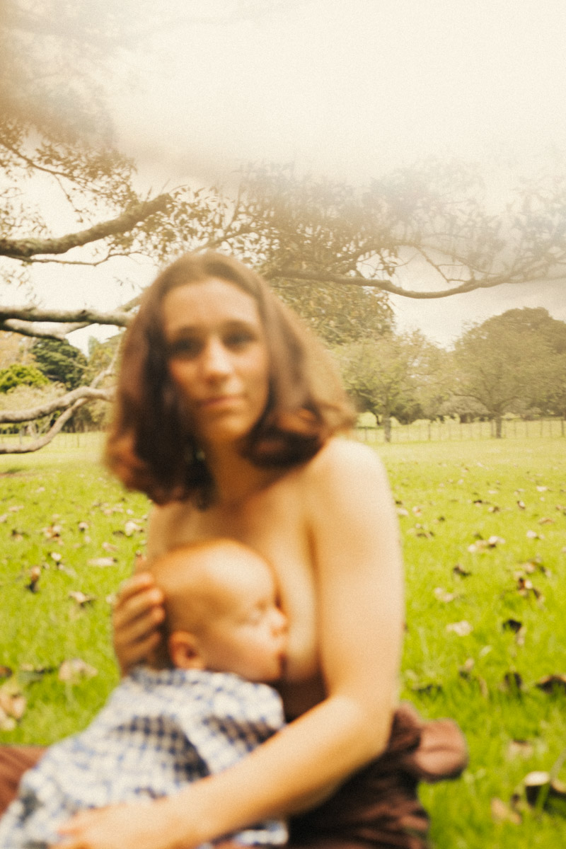 A film portrait of daughter breastfeeding from her mum in Auckland by Eilish Burt Photography
