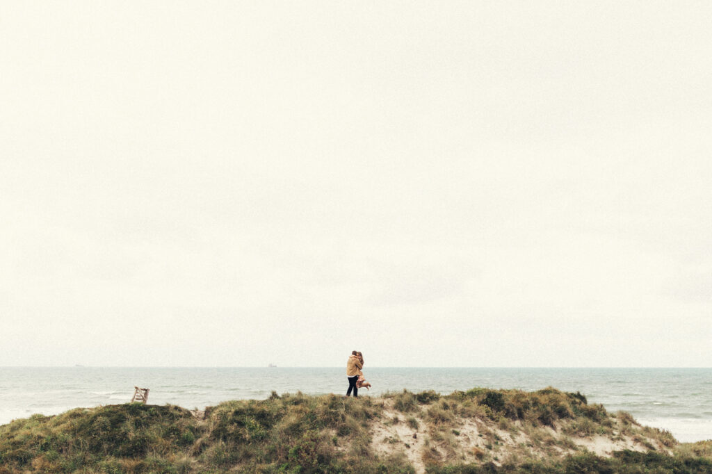 A photo captured of a surprise proposal at the beach of Papamoa by Eilish Burt Photography