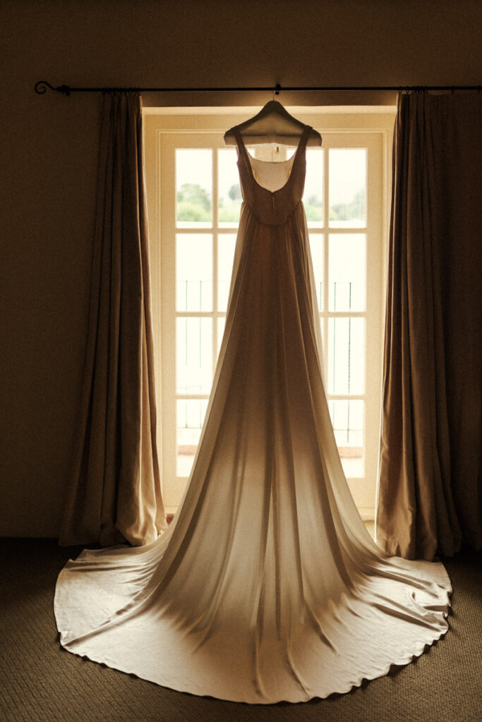 Custom wedding gown made by the brides designer brother in Auckland. Captured by Eilish Burt Photography