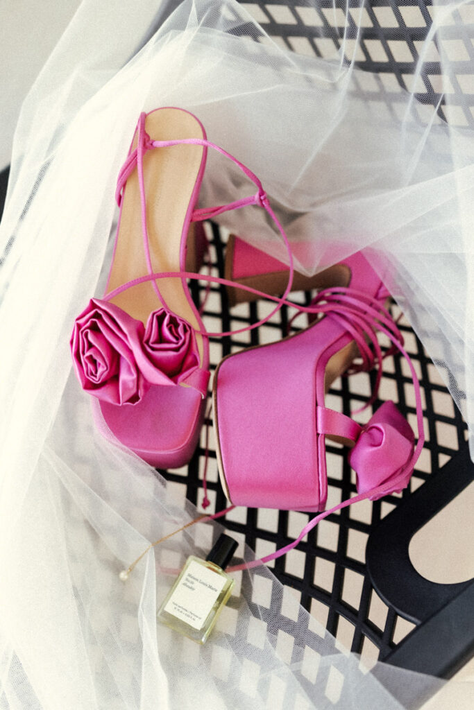 Sky-high, hot pink pumps for the bride on her wedding day on Waiheke Island. Captured by Eilish Burt Photography.