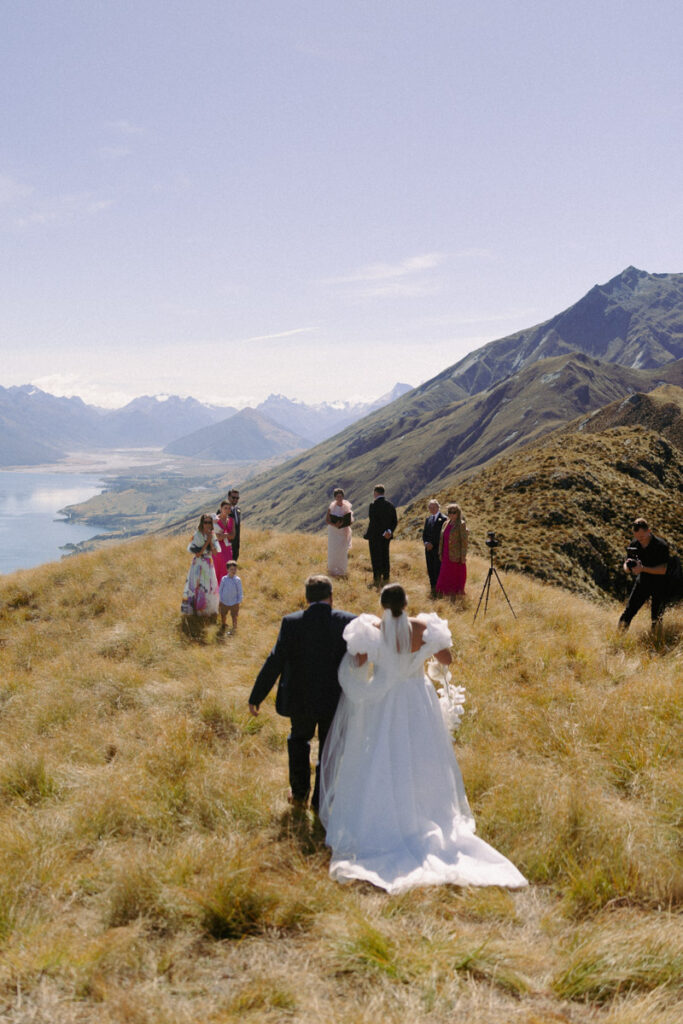 A wedding ceremony on top of Mount Creighton, Queenstown, overlooking Lake Wakatipu. Captured by Eilish Burt