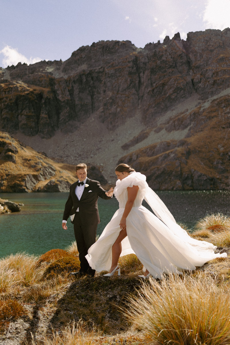 A beautiful couple celebrate their epic destination wedding in Queenstown on a mountain top