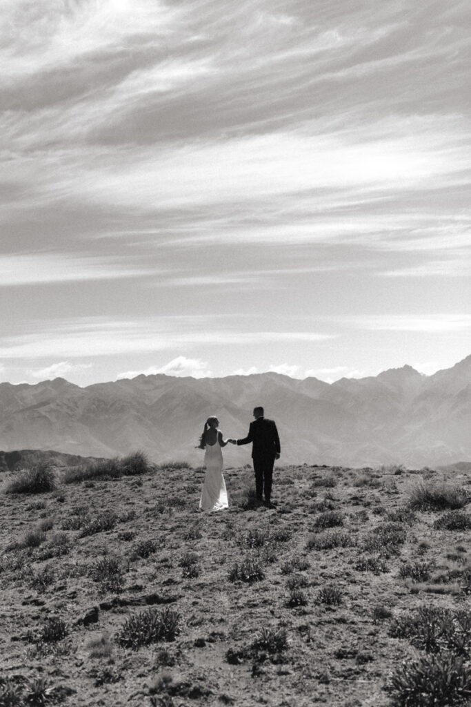 A wedding couple are photographed on the top of the stunning Kaikoura ranges for their wedding elopement.