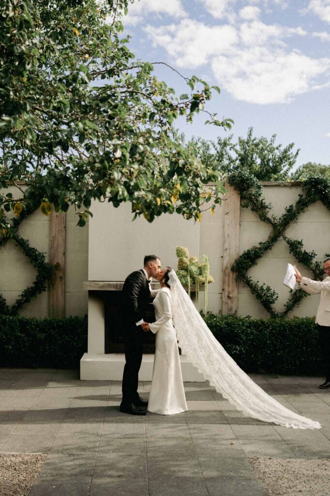 Romantic garden wedding portrait of Hayley and Liam at Ataahua Garden Venue in the Bay of Plenty, New Zealand.